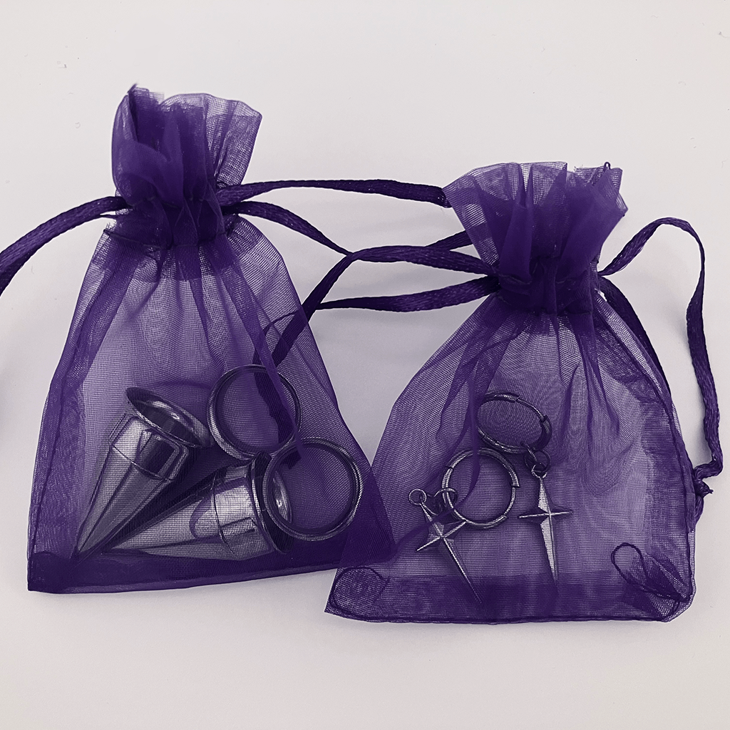 Earrings in purple organza bags